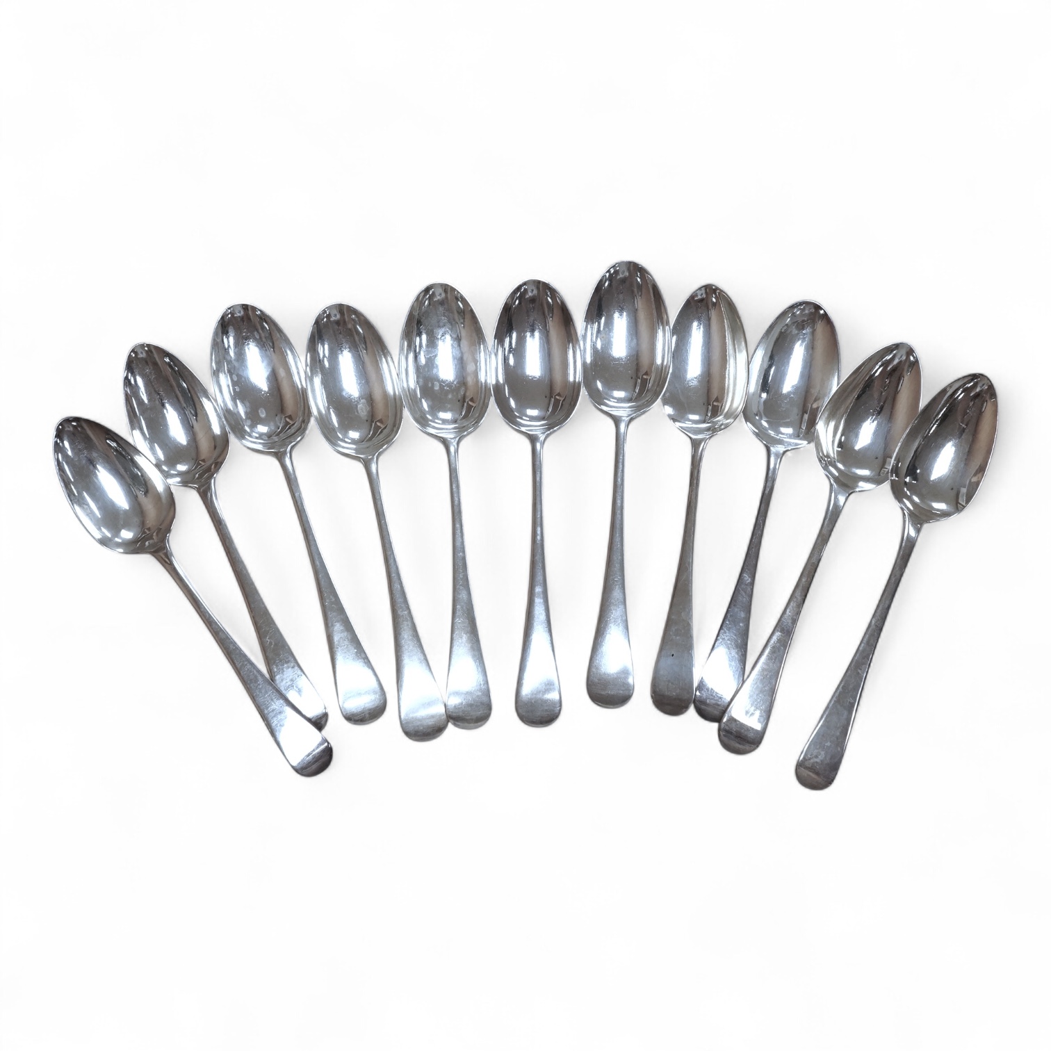 Eleven assorted 19th century silver Old English pattern dessert spoons, various dates and makers, 15.5oz.